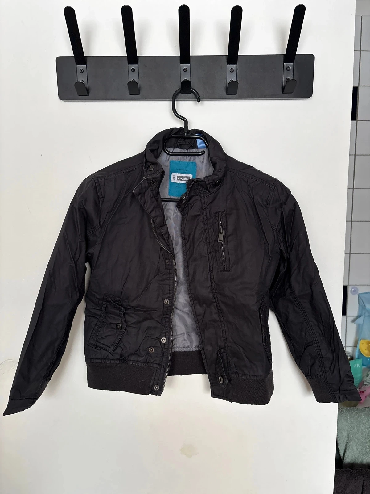Veste Okaïdi, 8 ans